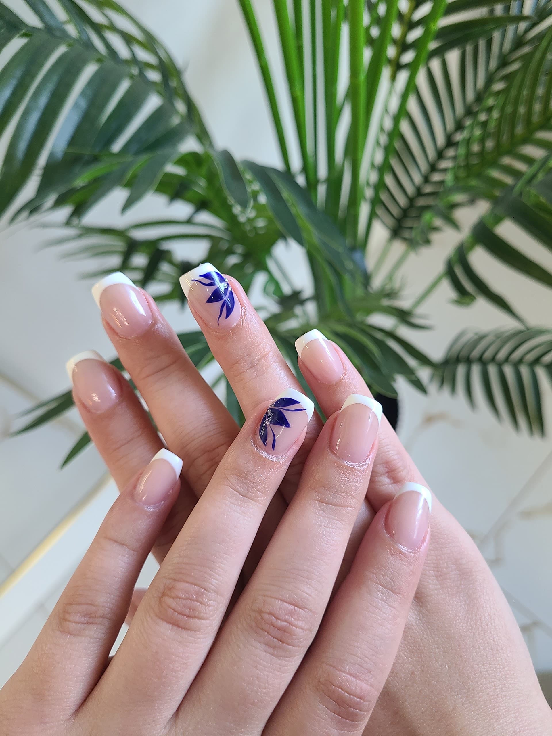 French set with hand-painted indigo leaf art by Tiara Nail Bar