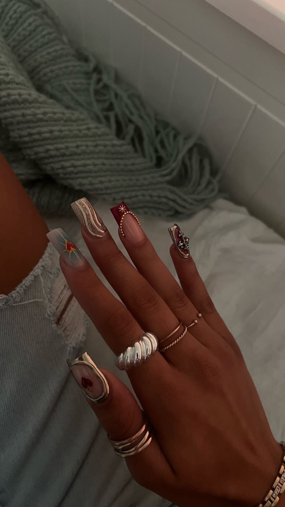 Gilded charms — nail set by Tiara Nail Bar